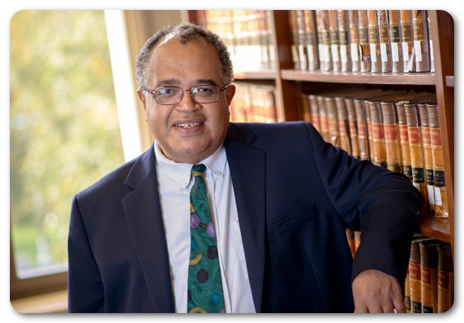 Man in front of bookcase