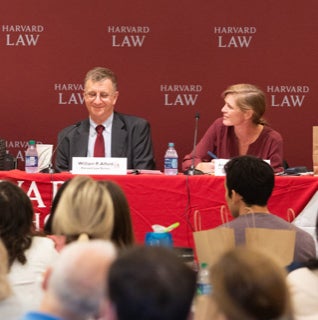 Bill Alford and Samantha Power speaking at a panel discussion discussion