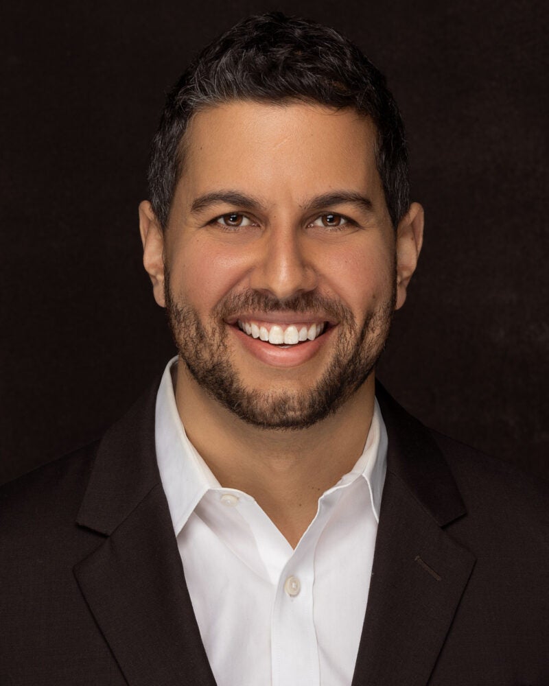 headshot of Amir Ali