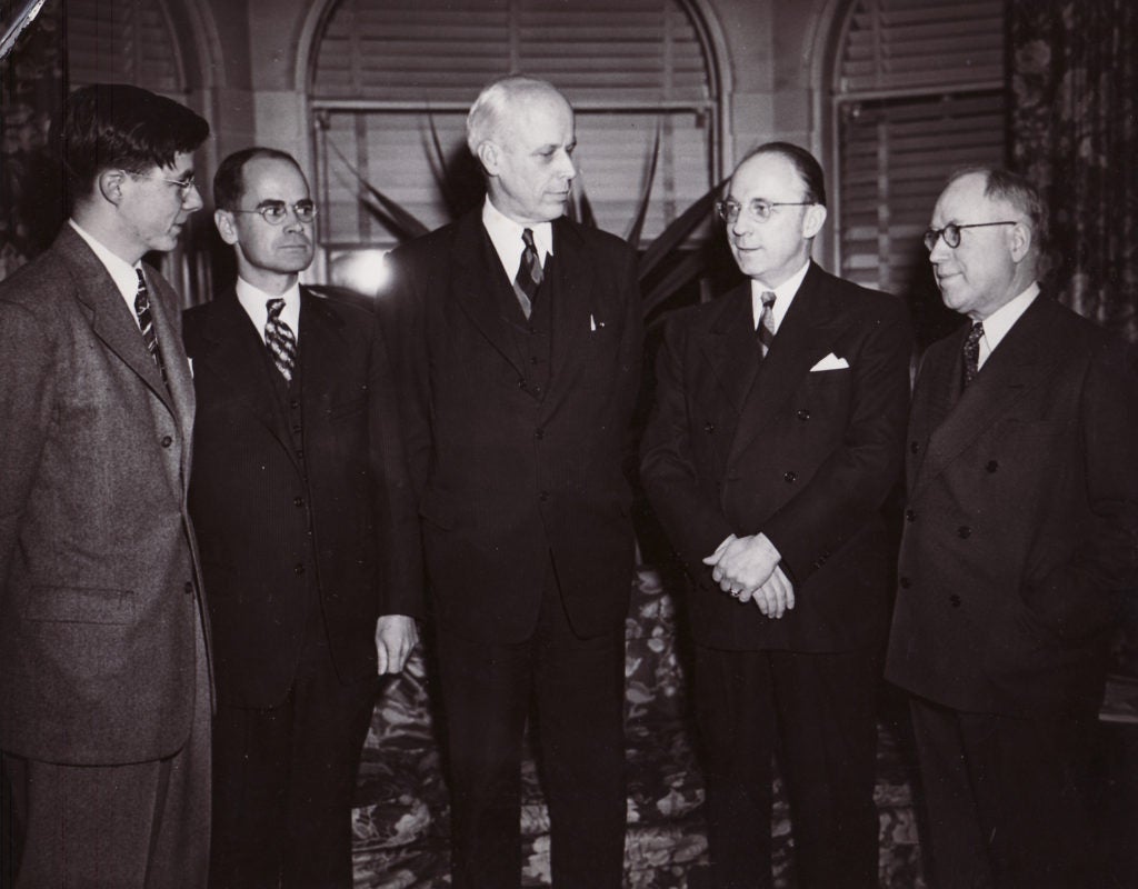 historic photo of group of men standing together