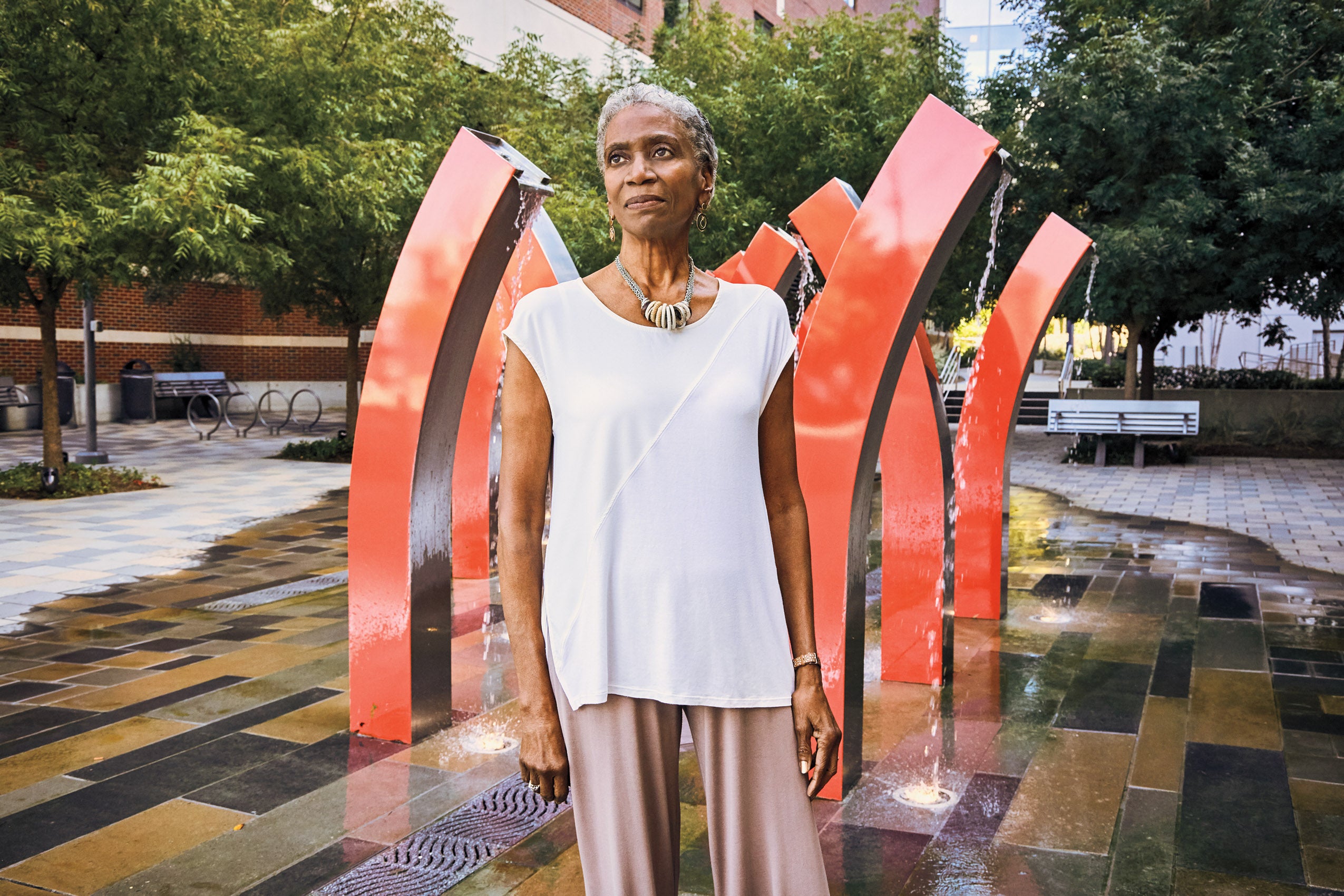 Judge McPherson in front of a water sculpture