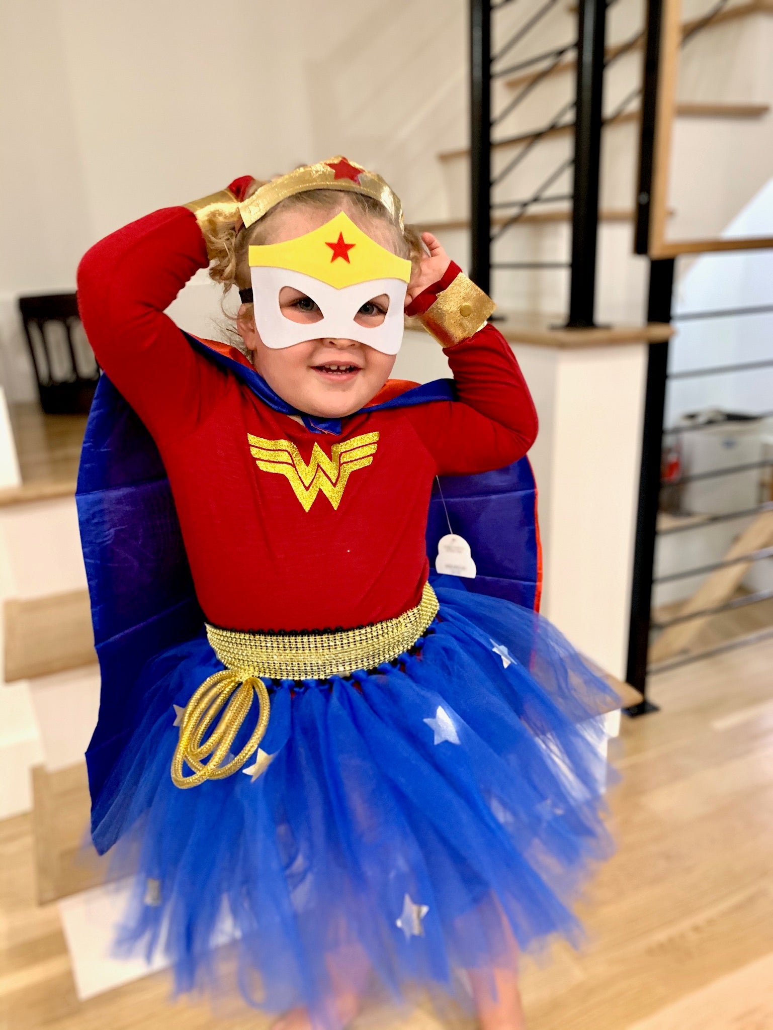 Young girl dressed as Wonder Woman.