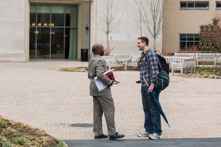 two people talking outside