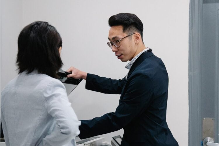 man using copy machine