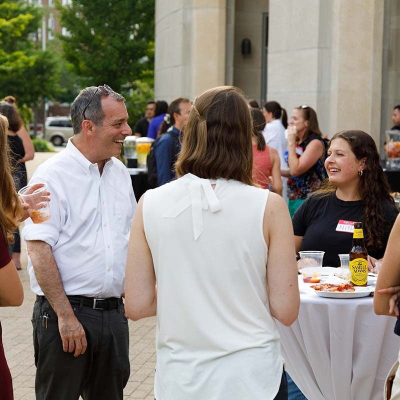 Dean John F. Manning speaks with incoming students at a Dean of Students welcome event on the Harvard Law campus.