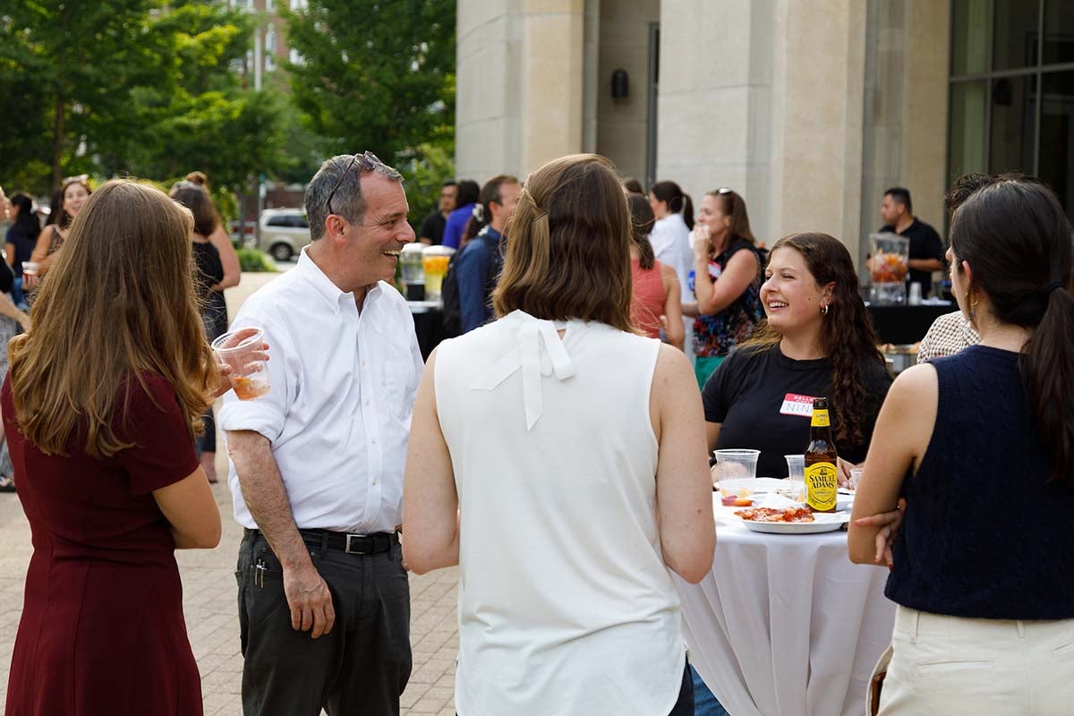 Dean John F. Manning speaks with incoming students at a Dean of Students welcome event on the Harvard Law campus.