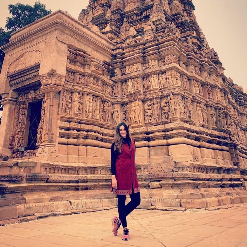 A student poses during her work abroad