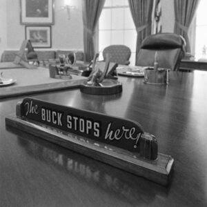 Close up of The Buck Stops Here! sign on the desk of President Harry Truman.