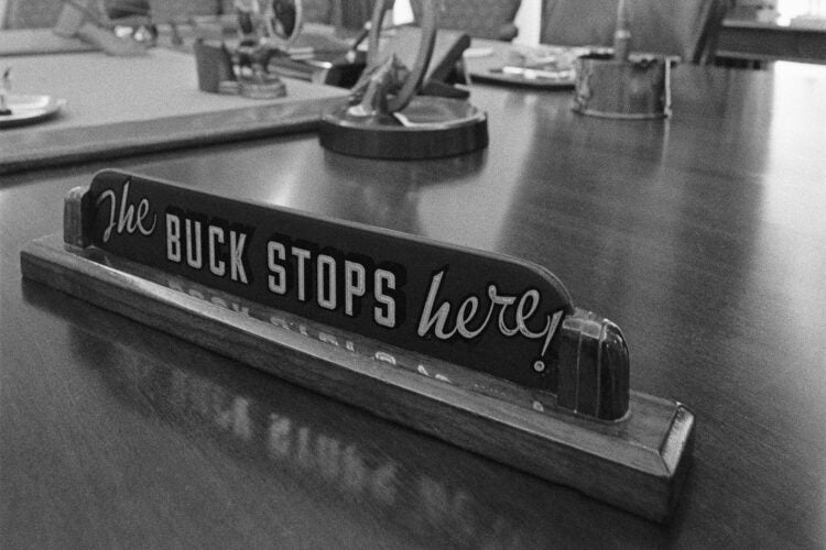 Close up of The Buck Stops Here! sign on the desk of President Harry Truman.