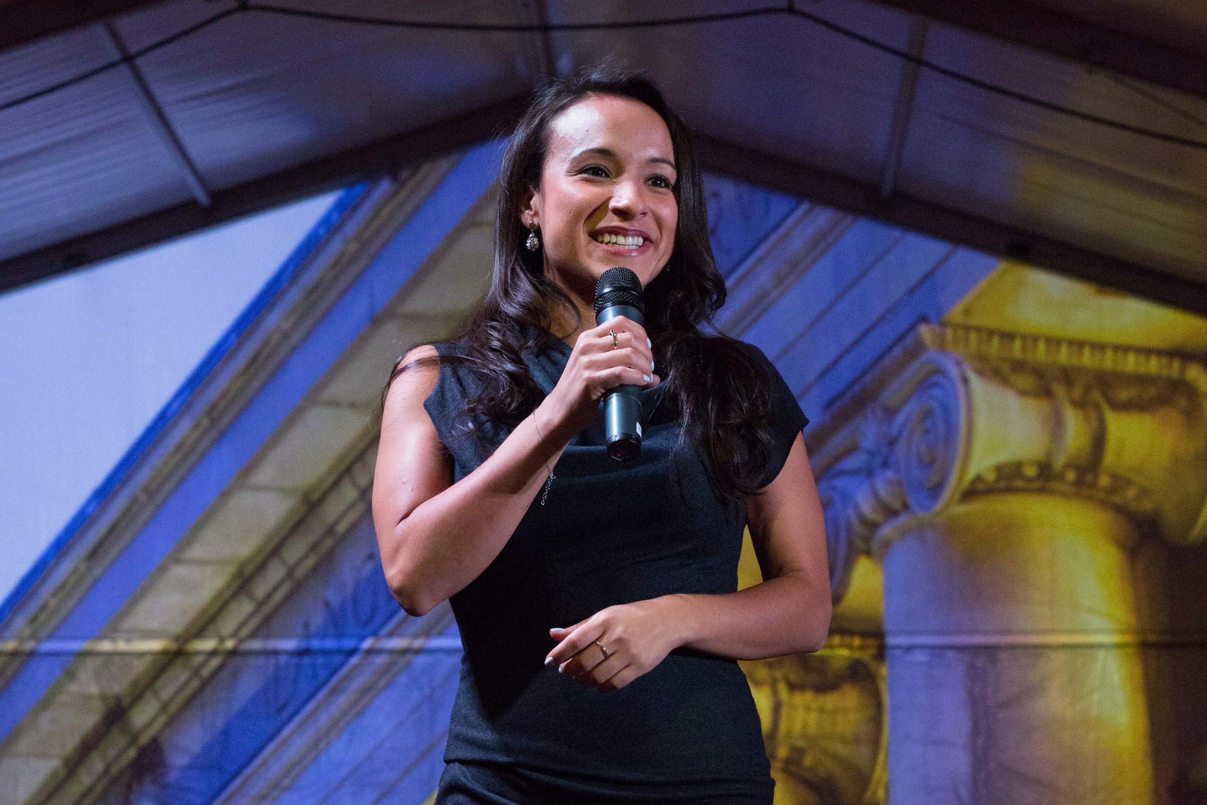 Bianca Tylek speaking with a microphone