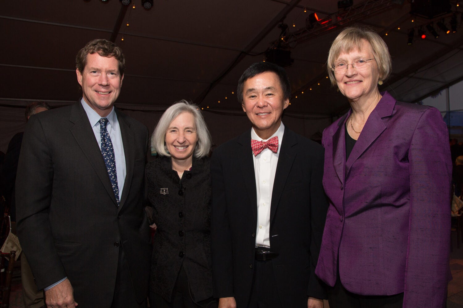 photo of four people standing together