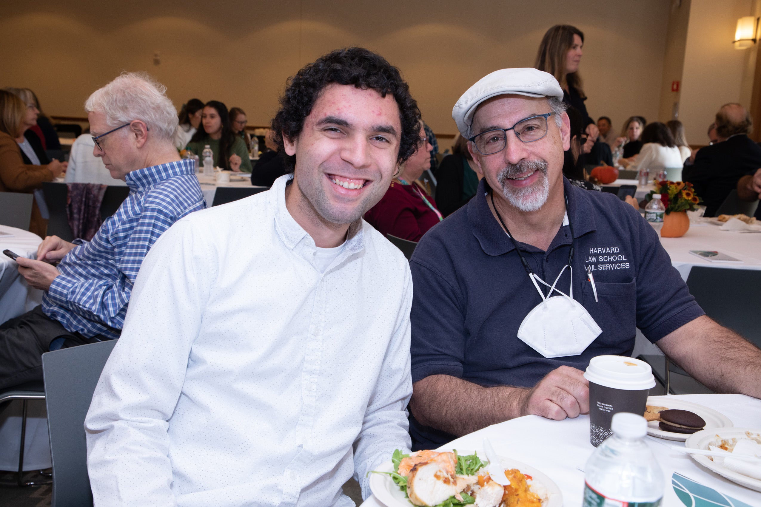 Two men pose for a photo