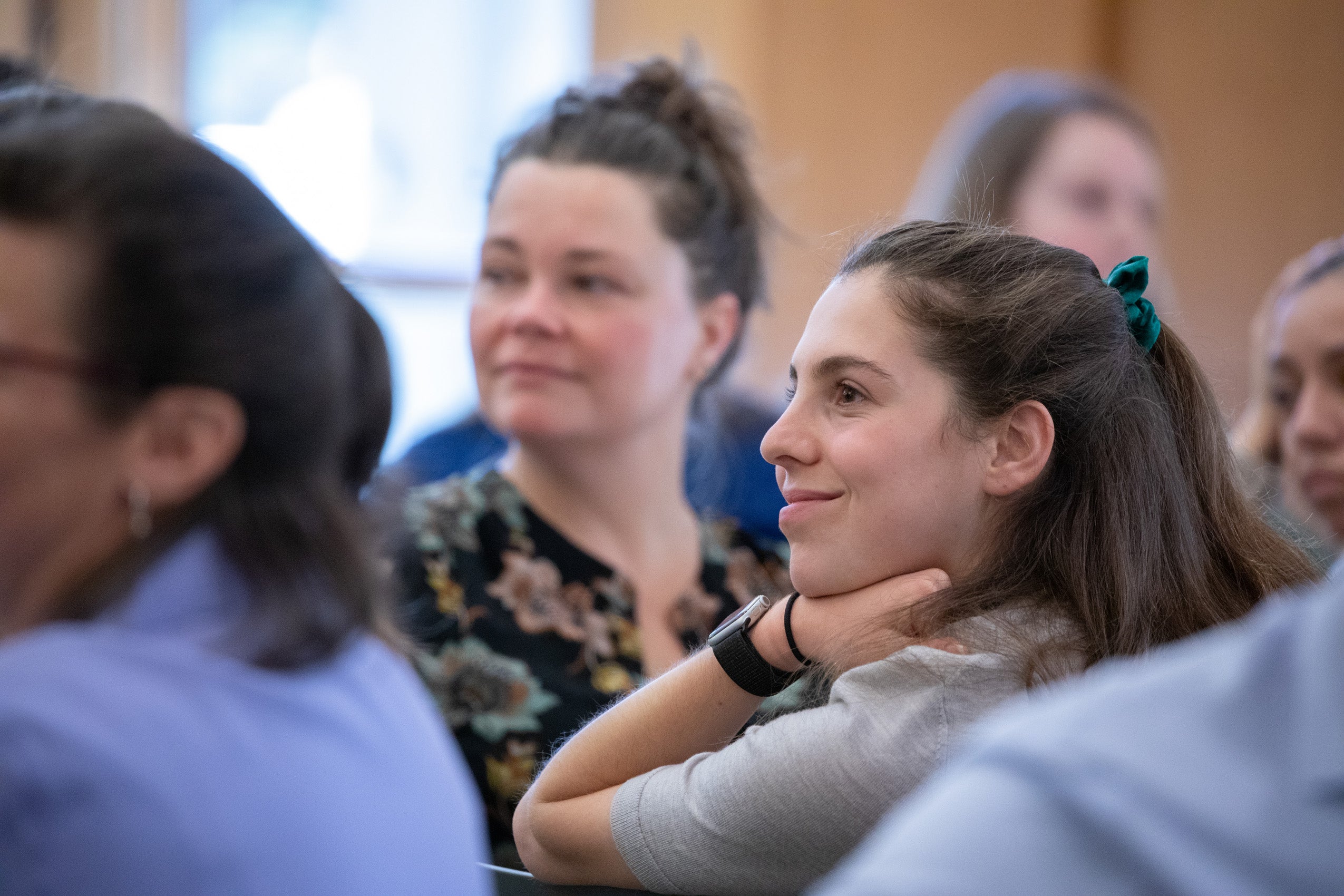 A close up of a woman face in a crowd