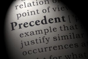 Dictionary definition of the word precedent. including key descriptive words.