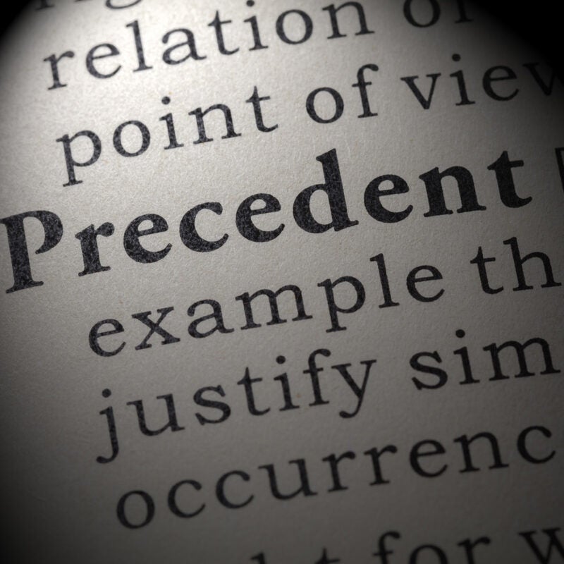Dictionary definition of the word precedent. including key descriptive words.