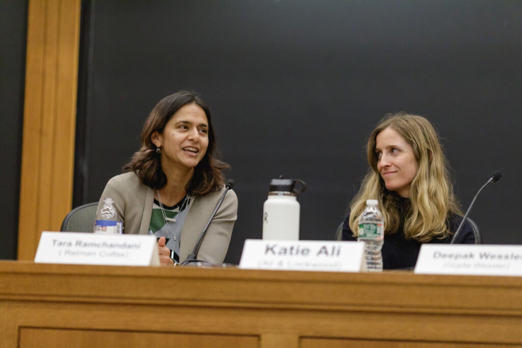 Tara Ramchandani speaking during the panel, Katie Ali sits next to her