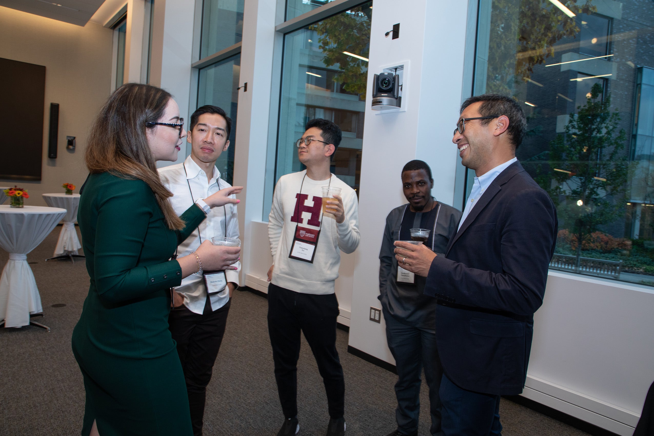Four LL.M. class of 2021 student talk with Professor Mark Wu at a reception