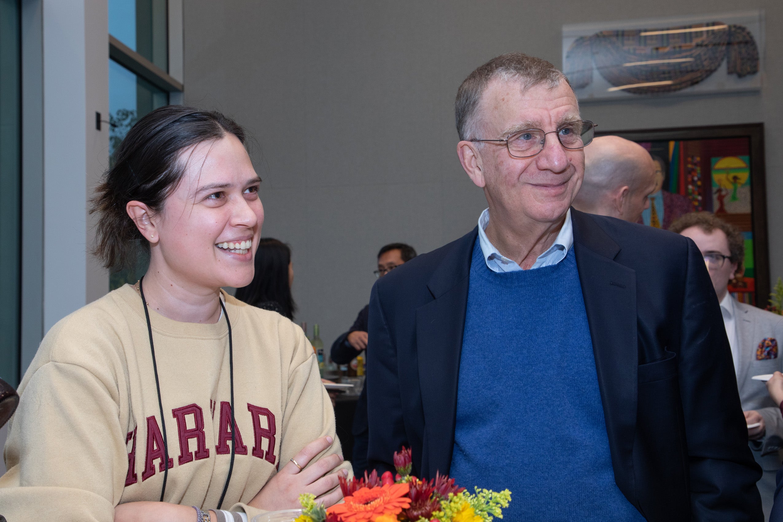 A student with Professor Bill Alford at at reception