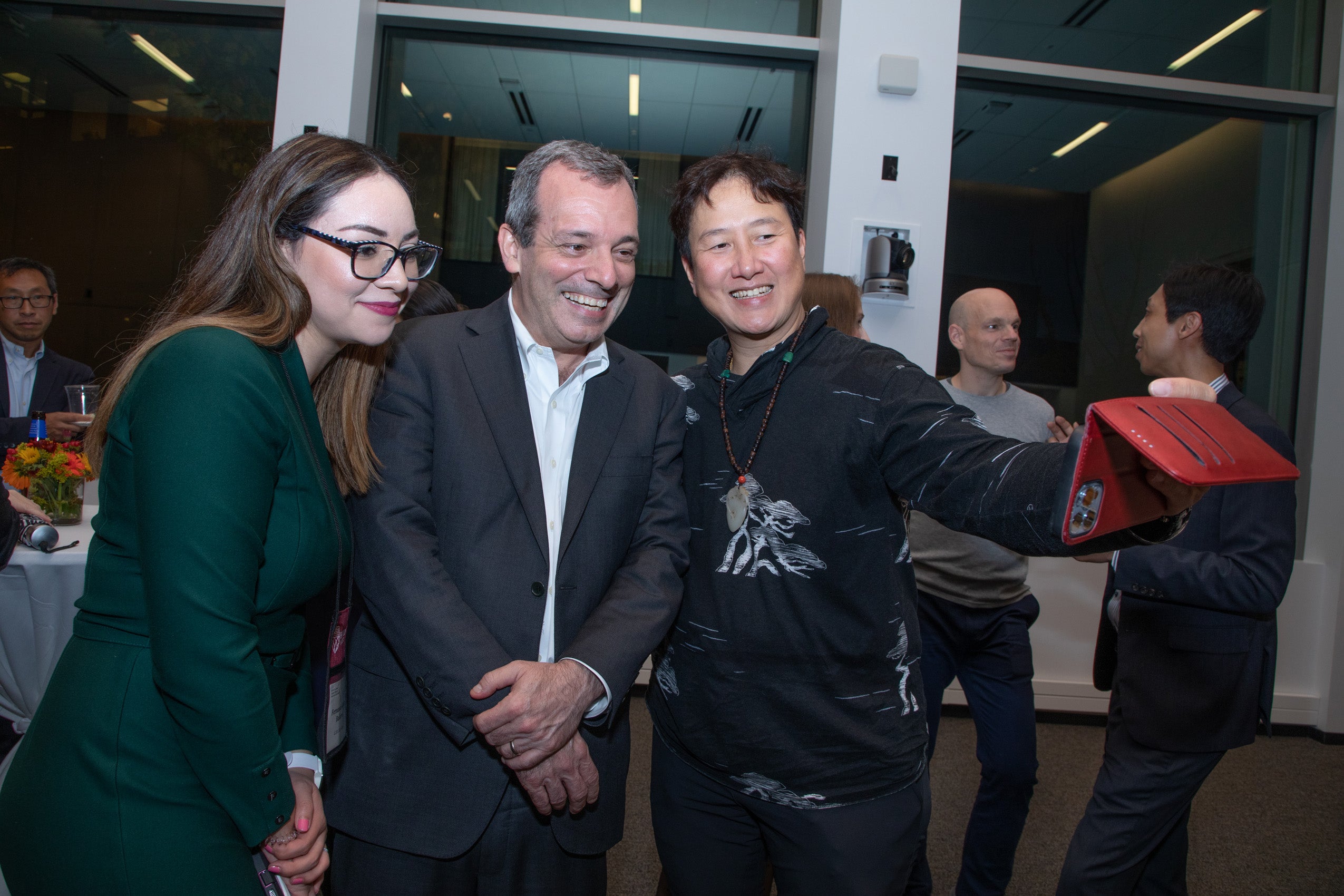 Dean Manning takes a selfie with two LL.M. students