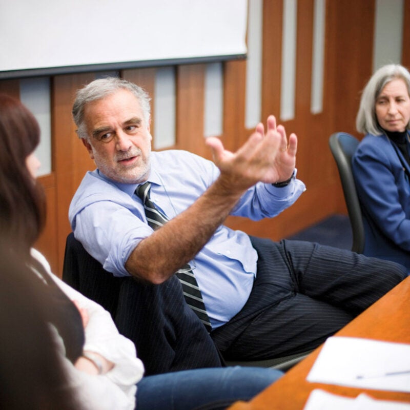 Luis Moreno-Ocampo (left) co-teaching a seminar at HLS with Martha Minow (right)