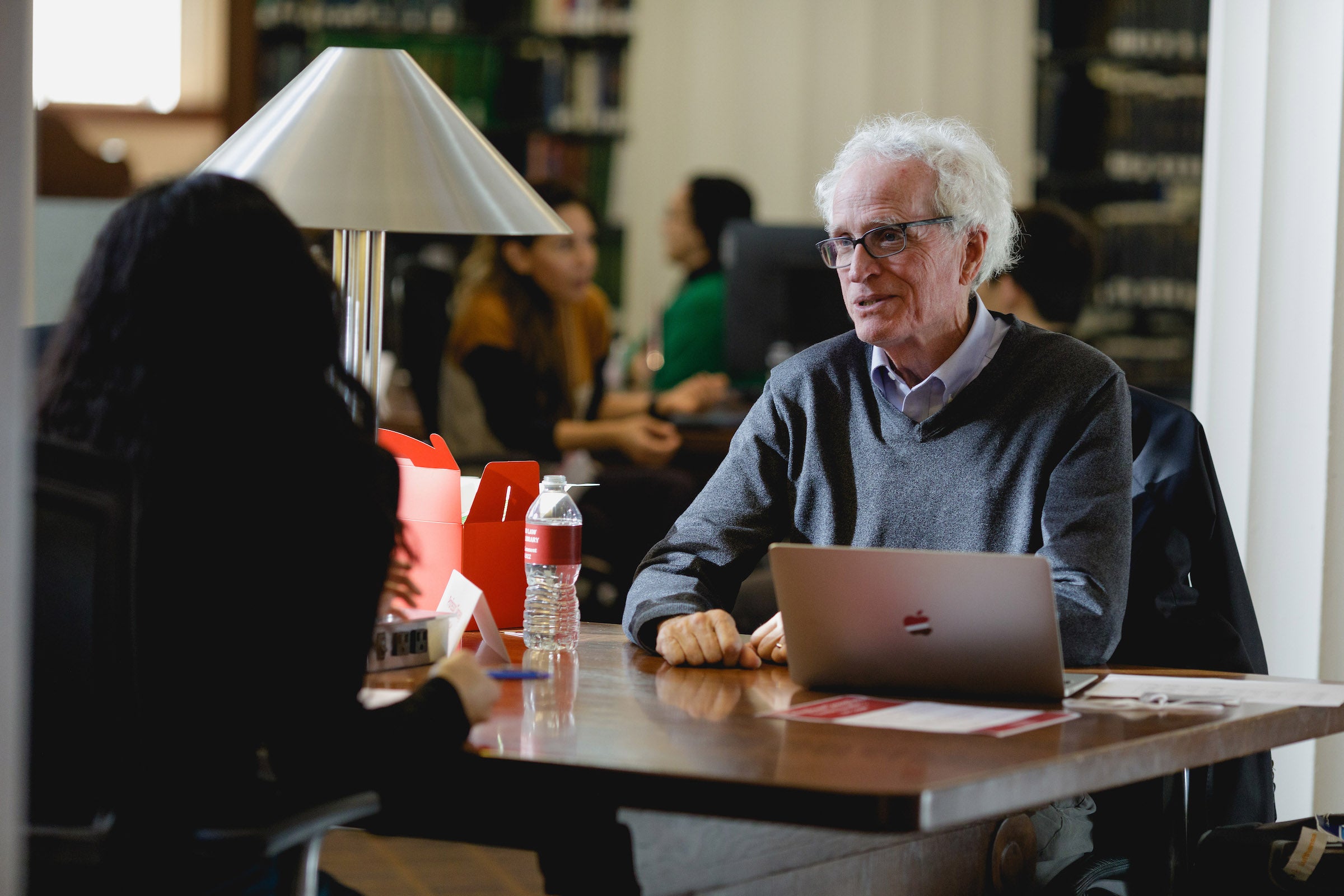 Jim Tierney speaks with a student.