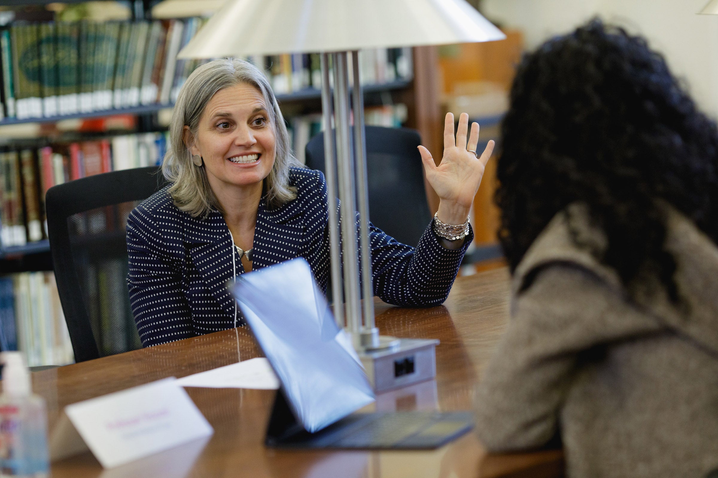 Rachel Viscomi speaking with a student.