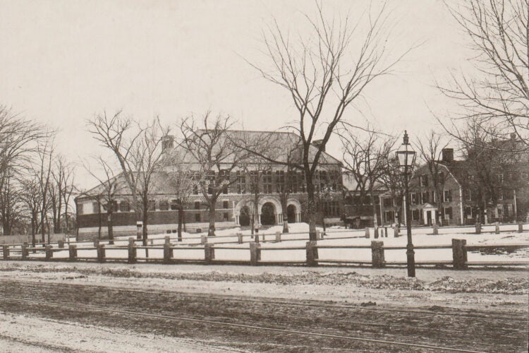 1883: The house to the right of Austin Hall was torn down in 1884. As a student, Oliver Wendell Holmes Jr. LL.B. 1866 had likely lived there. It’s where his father grew up.