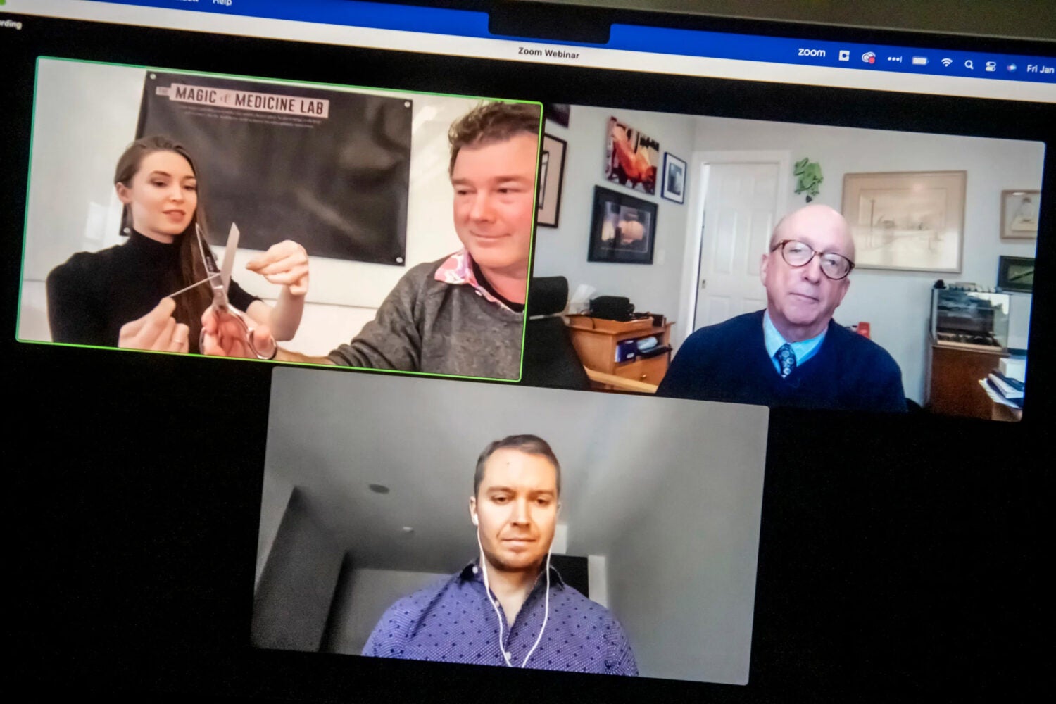 Four panelists on a screen.