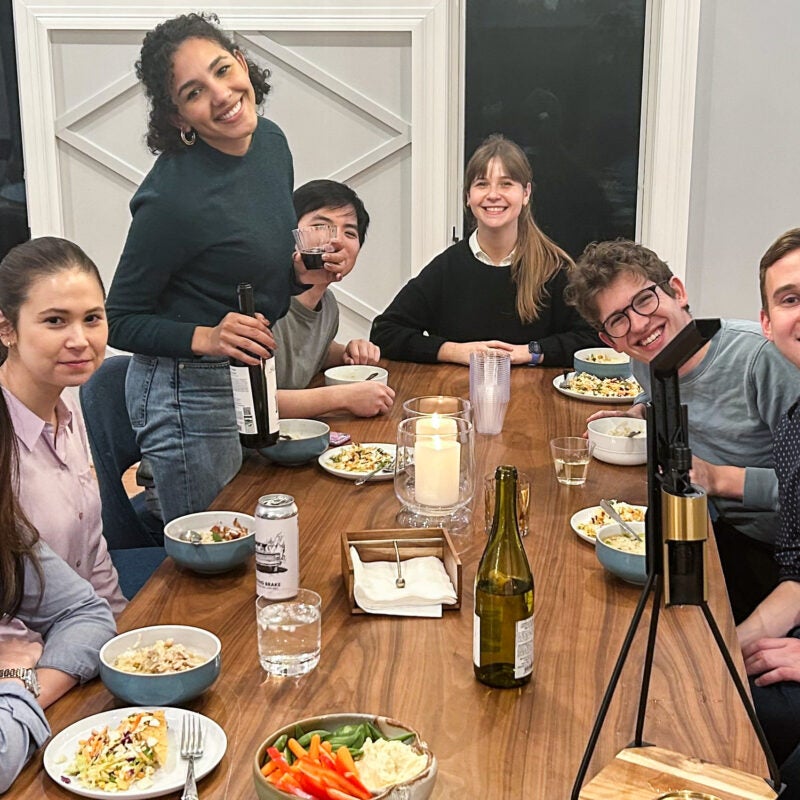 A group of students eating around a table