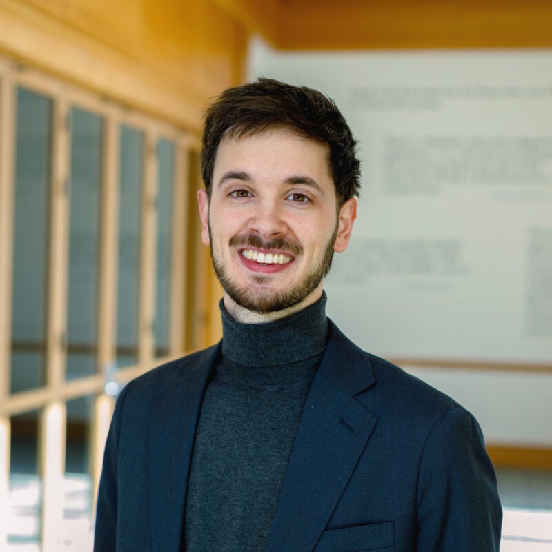 Portrait of Francisco Balbin wearing a blue blazer.