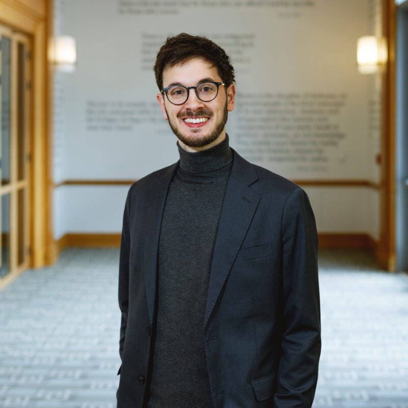 Portrait of Francisco Balbin wearing a blue blazer.