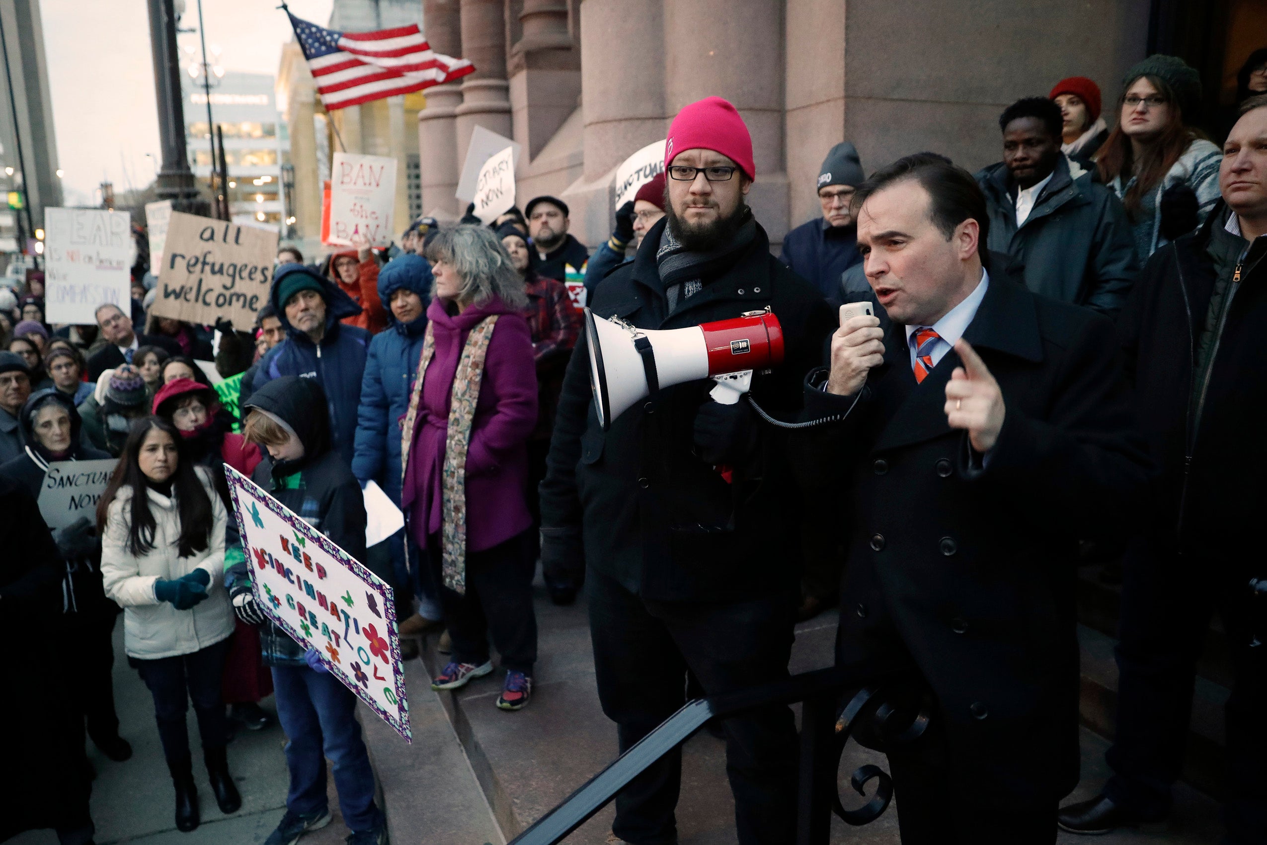 A mayor speaks during a demonstration
