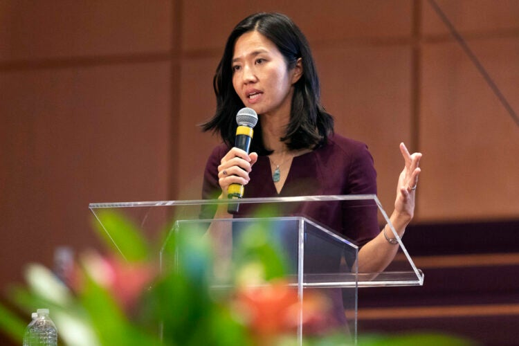 A woman speaking at a podium