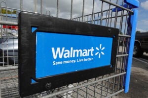 Close up of the logo on a Walmart shopping cart.
