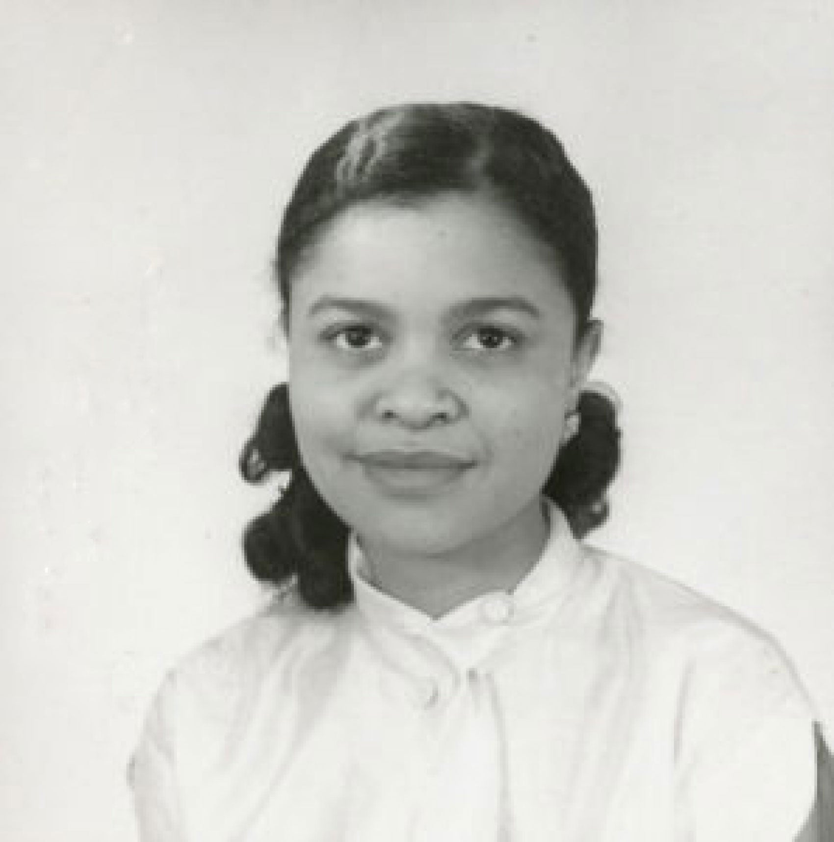 a black and white headshot of a young woman