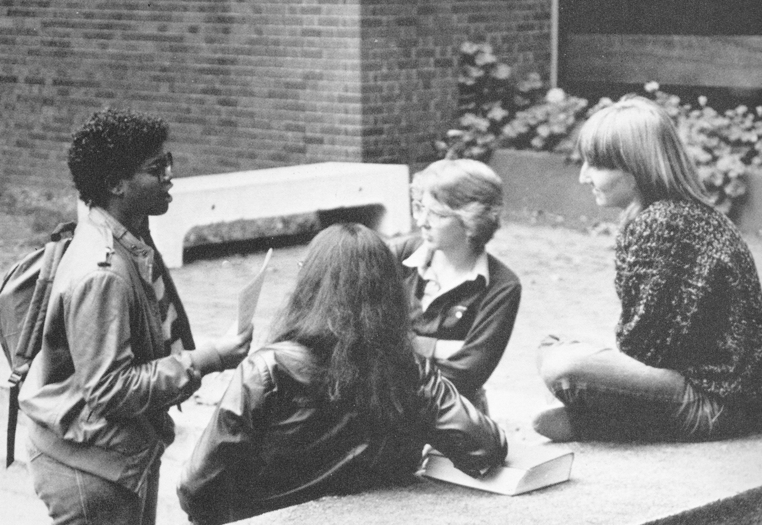 A group of women sitting outside talking