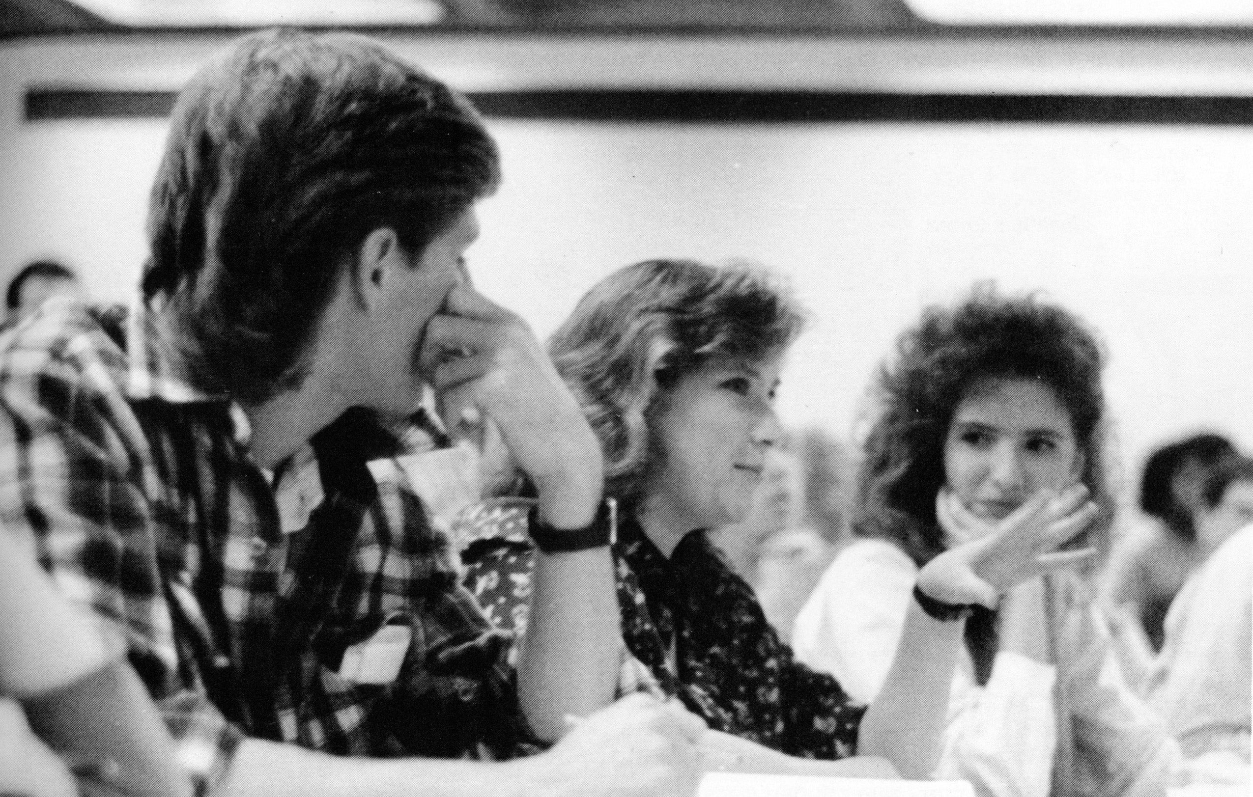 A woman makes a point in a classroom closeup
