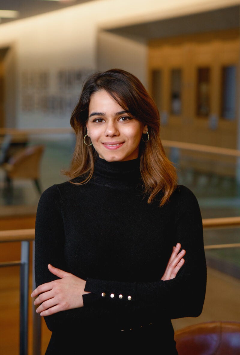 A portrait of a woman in a black turtleneck.