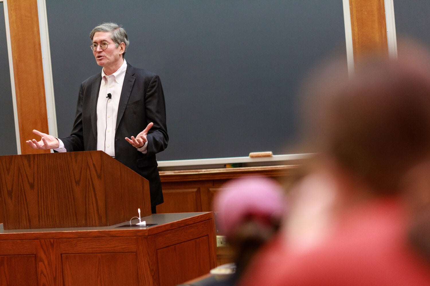 Michael Klarman speaks to the audience from a lectern.