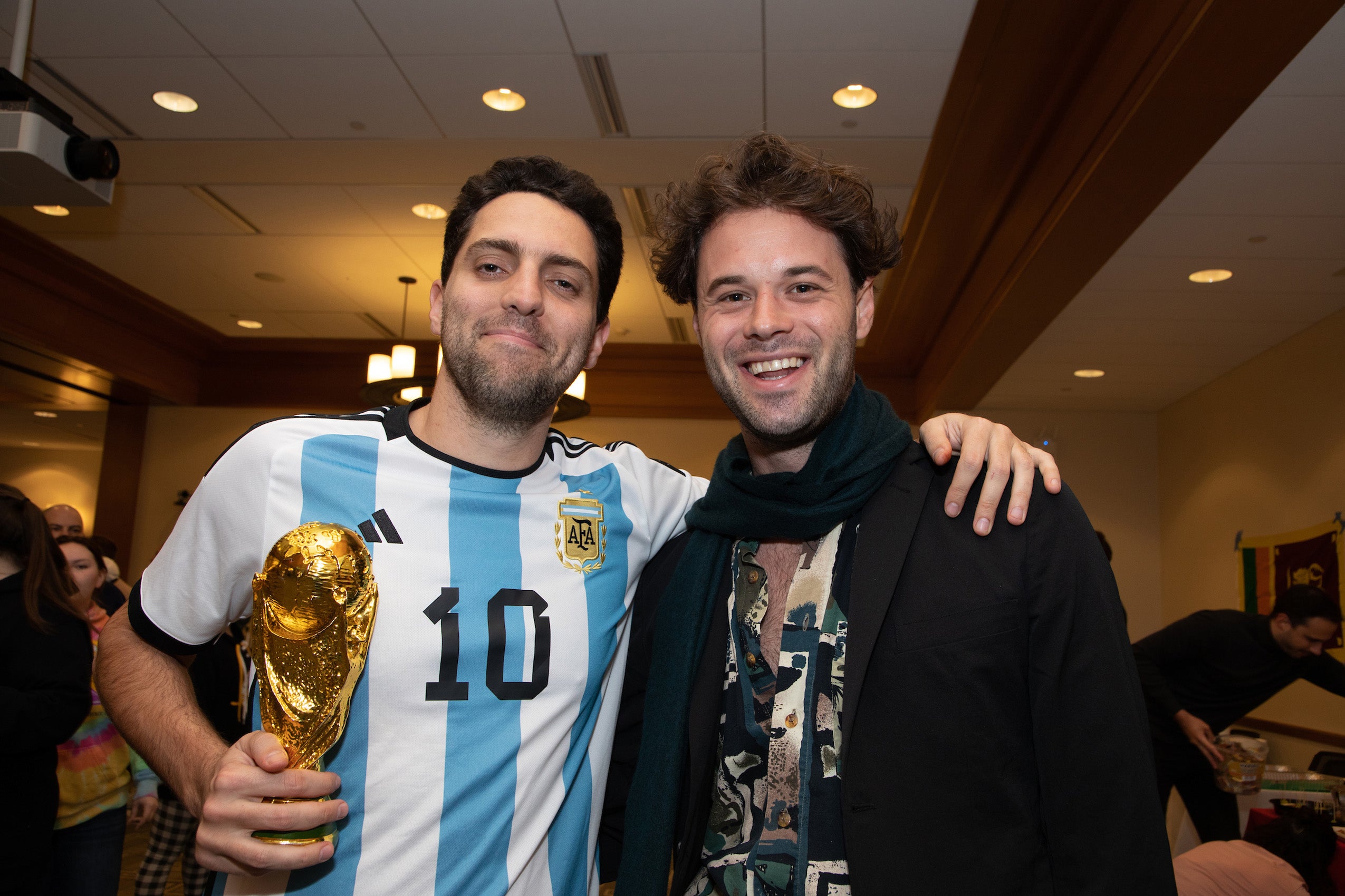 Two men pose for the camera