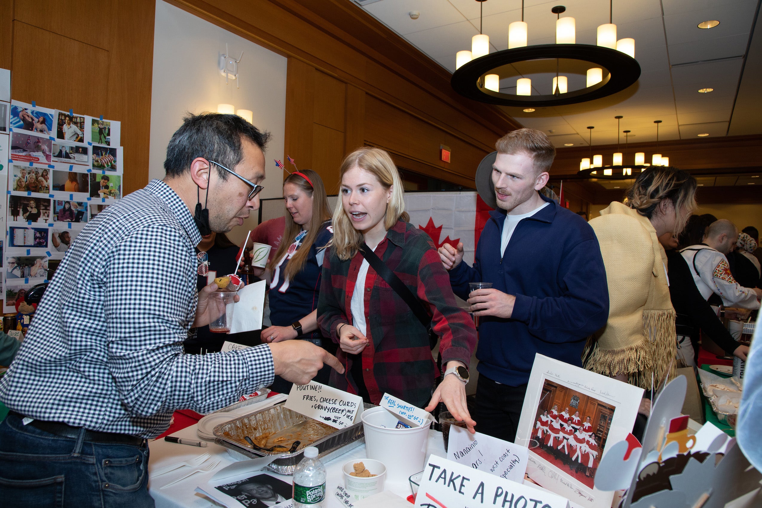 People talking at a table at an event