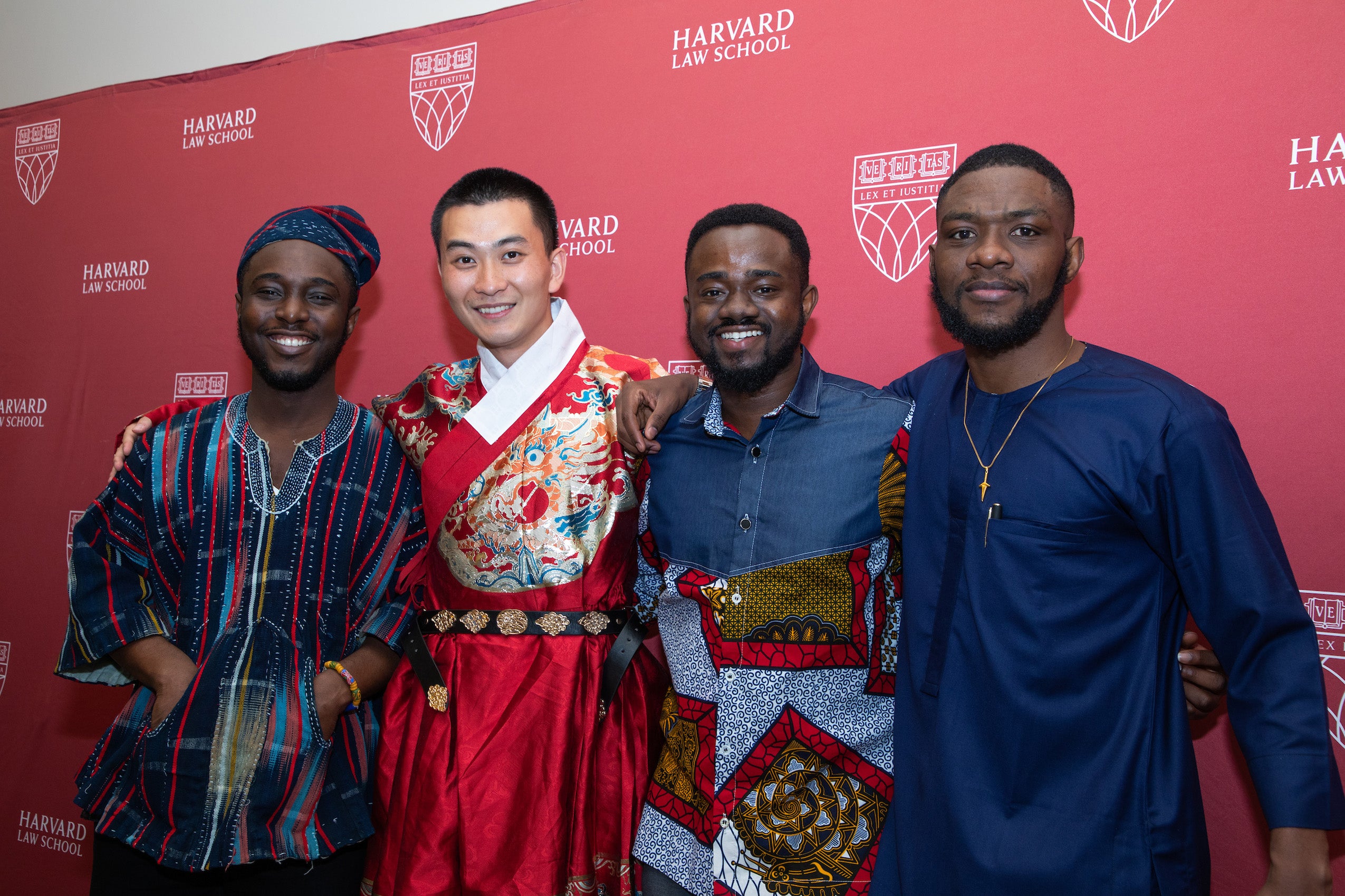 Four men in dress from their homeland