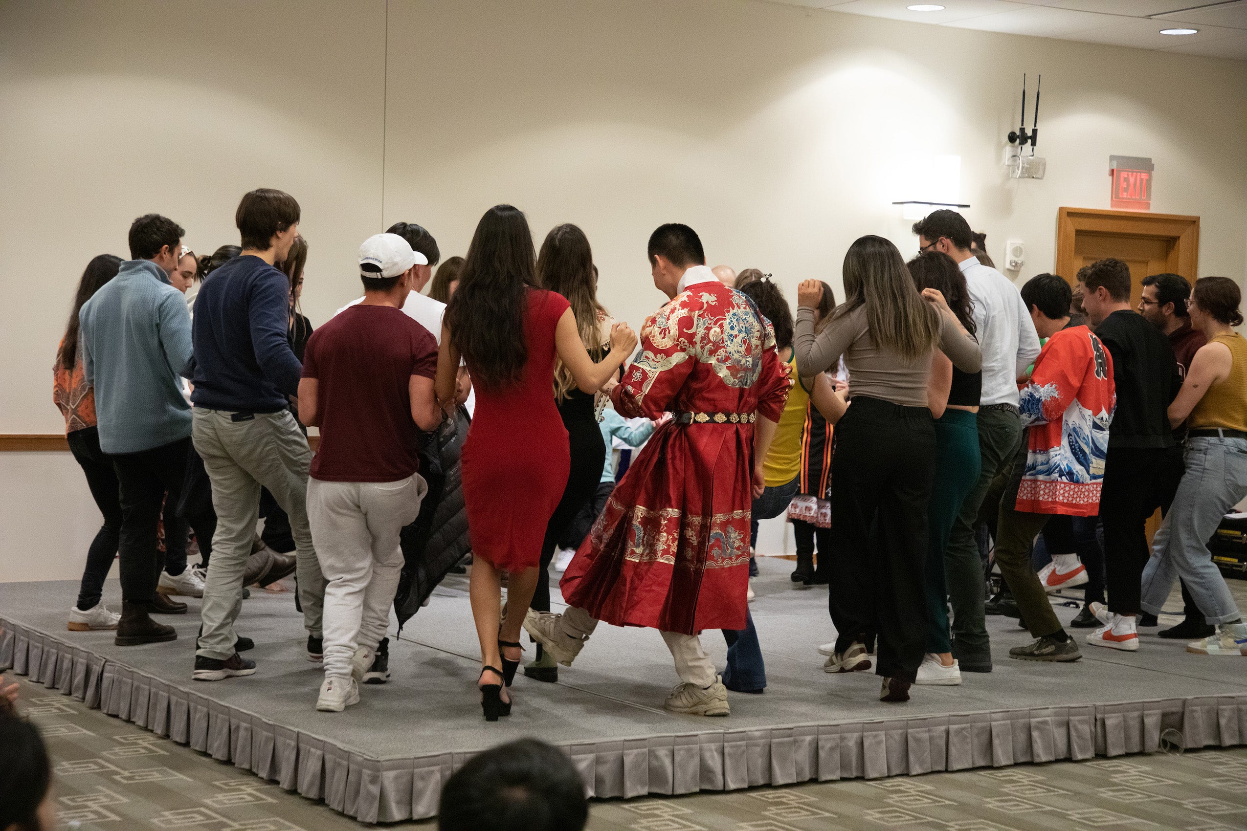 A group of people dance on a stage