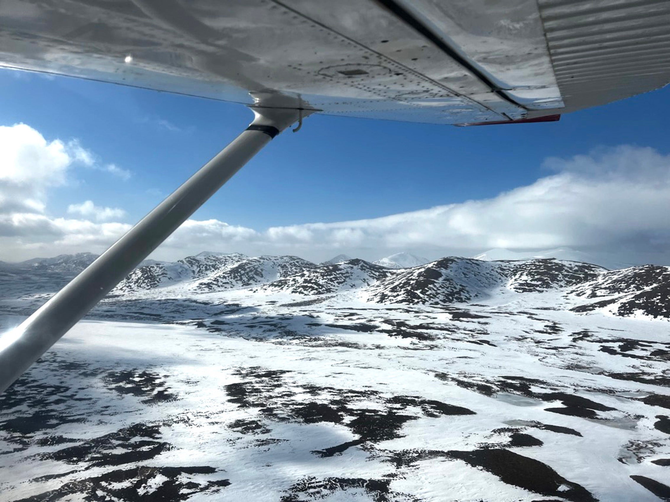 An aerial view of snow-covered mountains