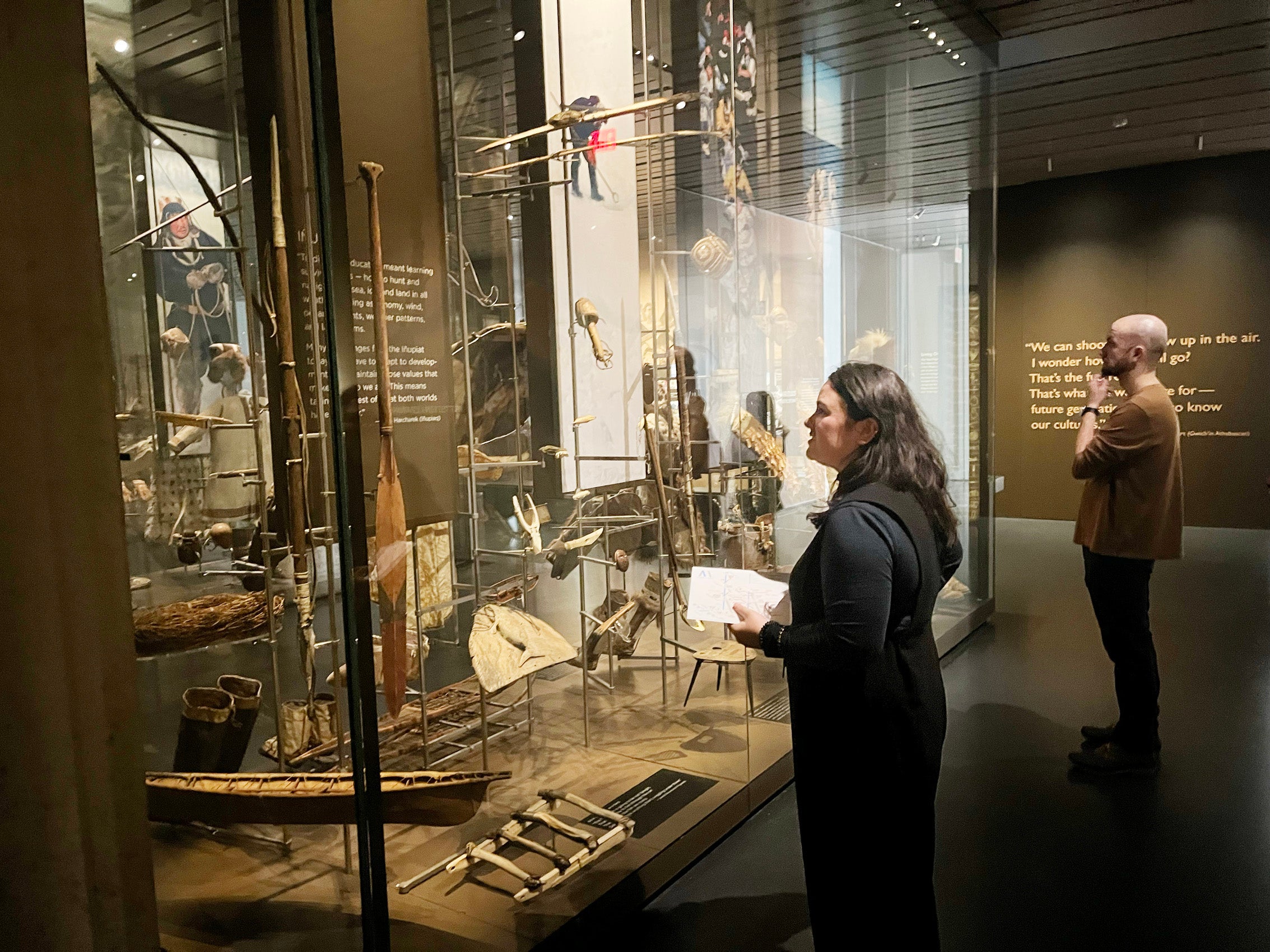 A woman looking at a display in a museum