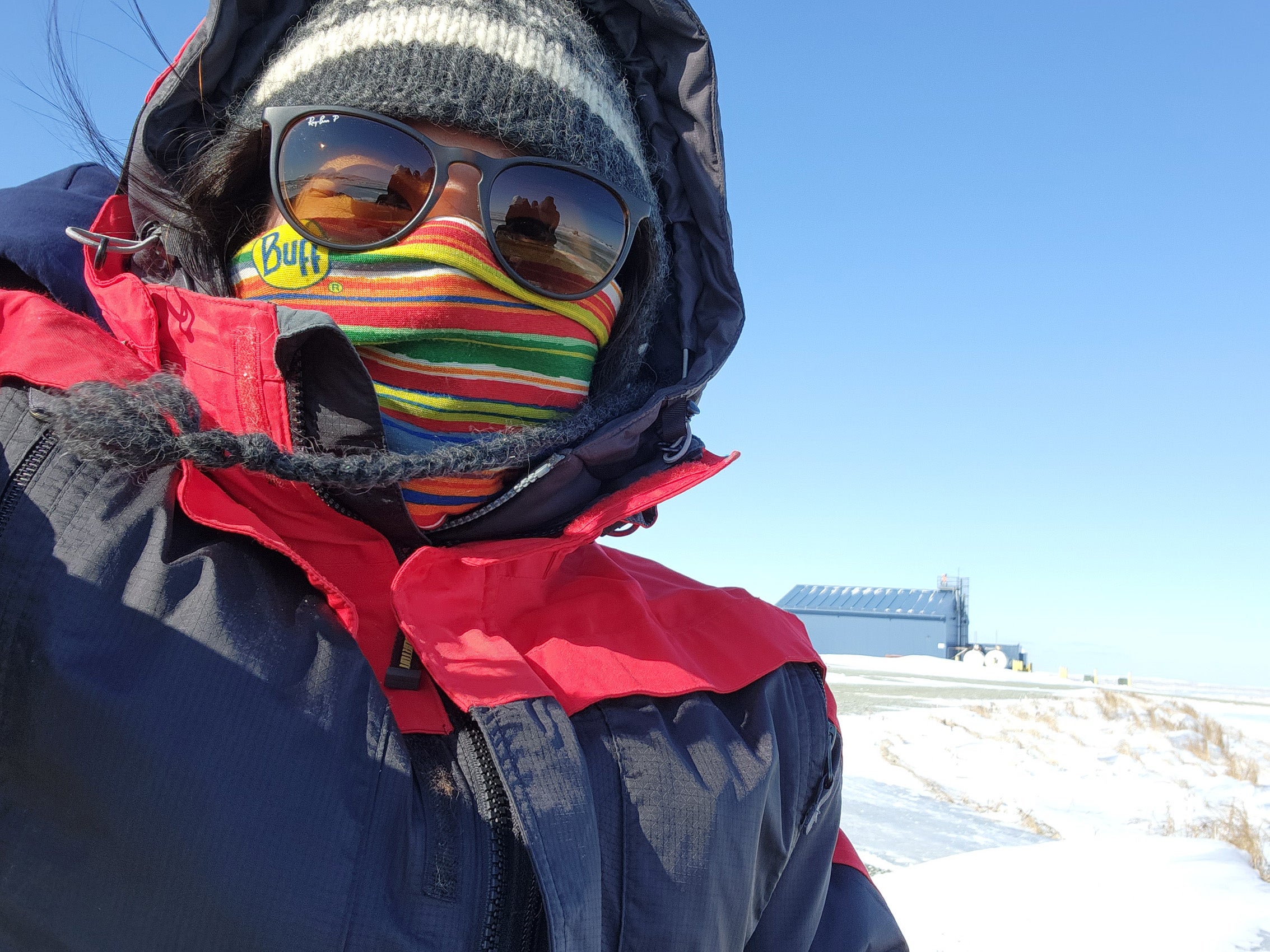 A closeup a a person dressed for cold weather
