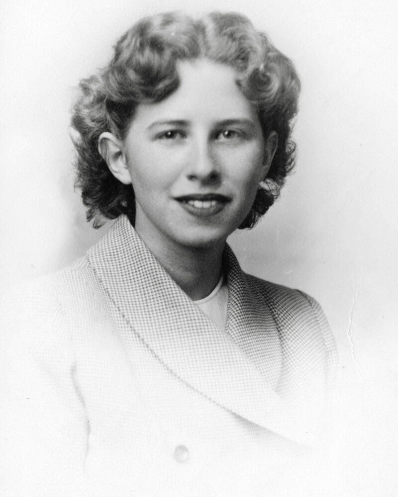 A black and white portrait of a woman from the 1950s.