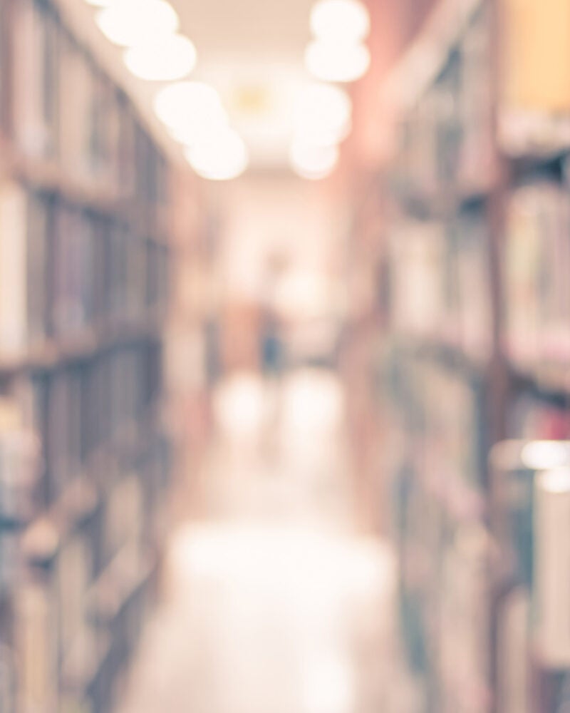 Blurry shot of bookshelves.