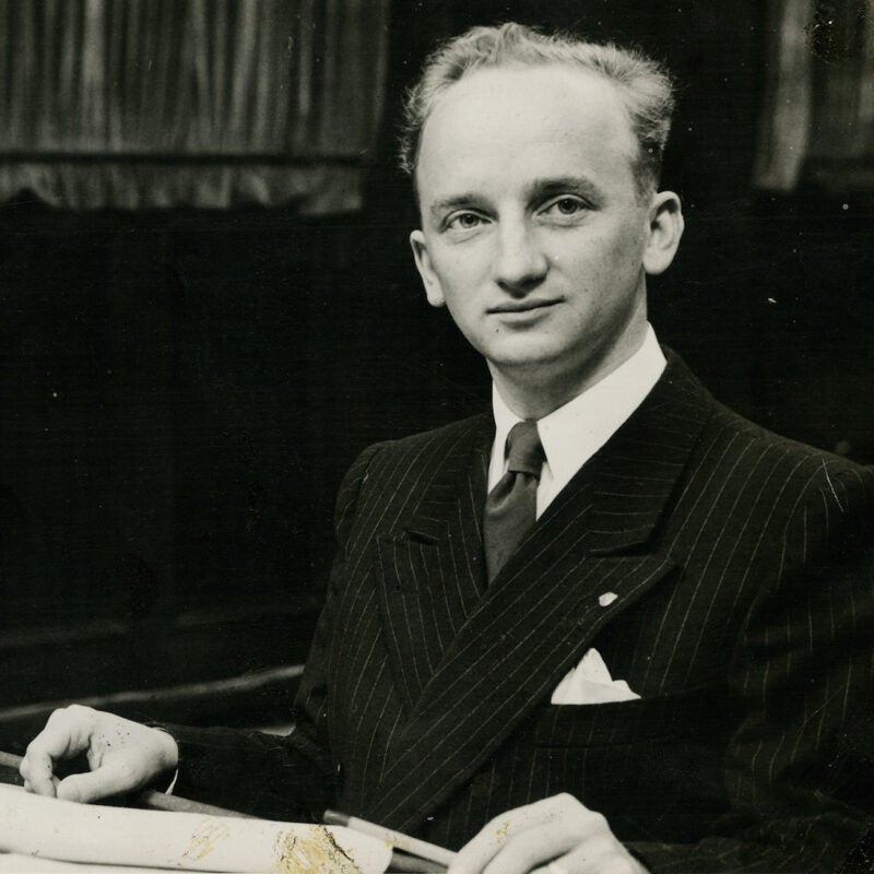 Ben Ferencz in 1947 standing at a podium.