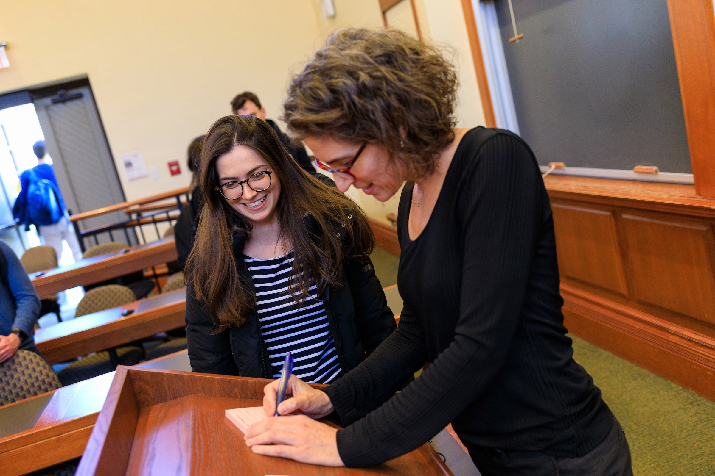 Alexandra Natapoff signs a